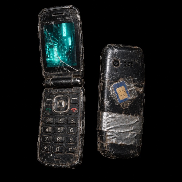 Burner Phone, a cheap cracked flip phone